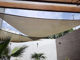 Premium Coolaroo shade sails for gardens and patios, with triangle, square and rectangle designs, breathable HDPE fabric and warranties up to 15 years.