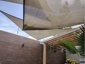 Premium Coolaroo shade sails for gardens and patios, with triangle, square and rectangle designs, breathable HDPE fabric and warranties up to 15 years.